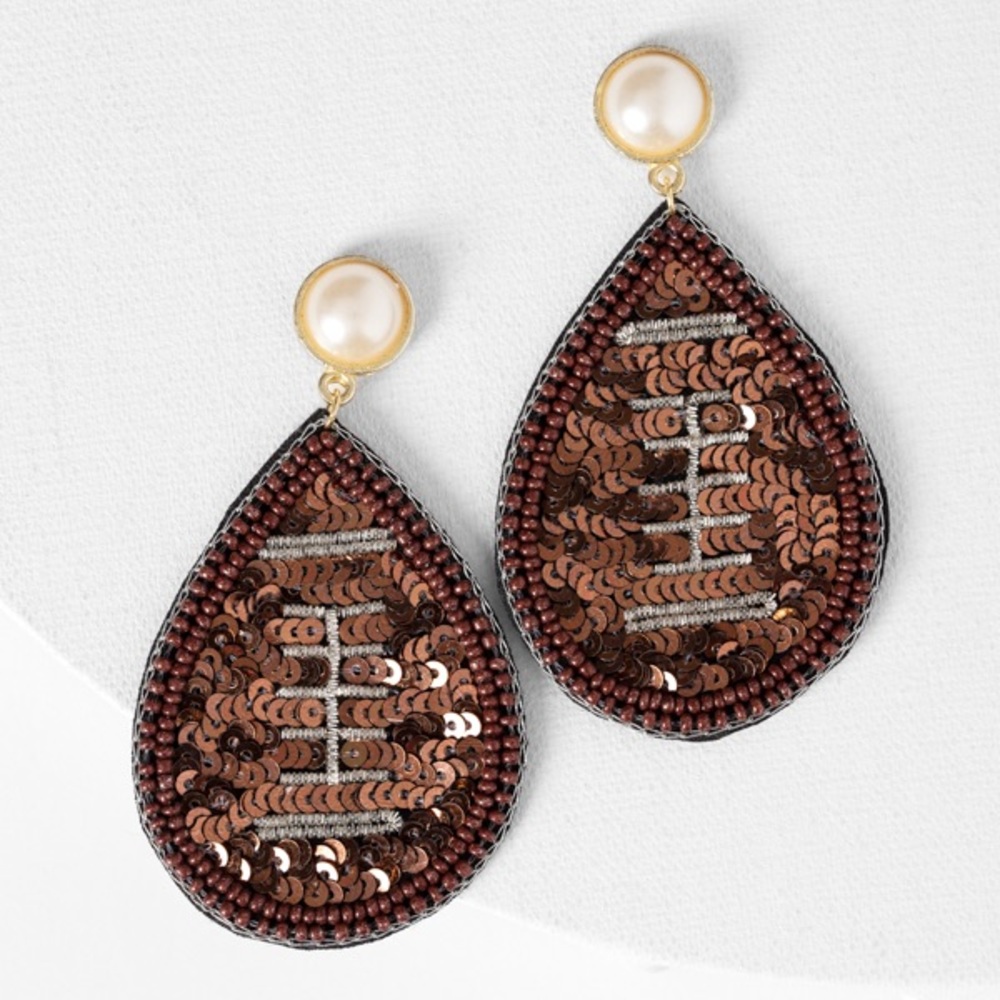 Adorable Plunder touchdown football earrings.